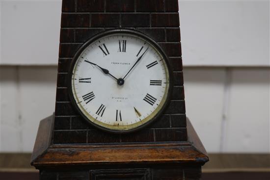 A late Victorian carved oak Lighthouse  clock barometer by Frank Flower of St James